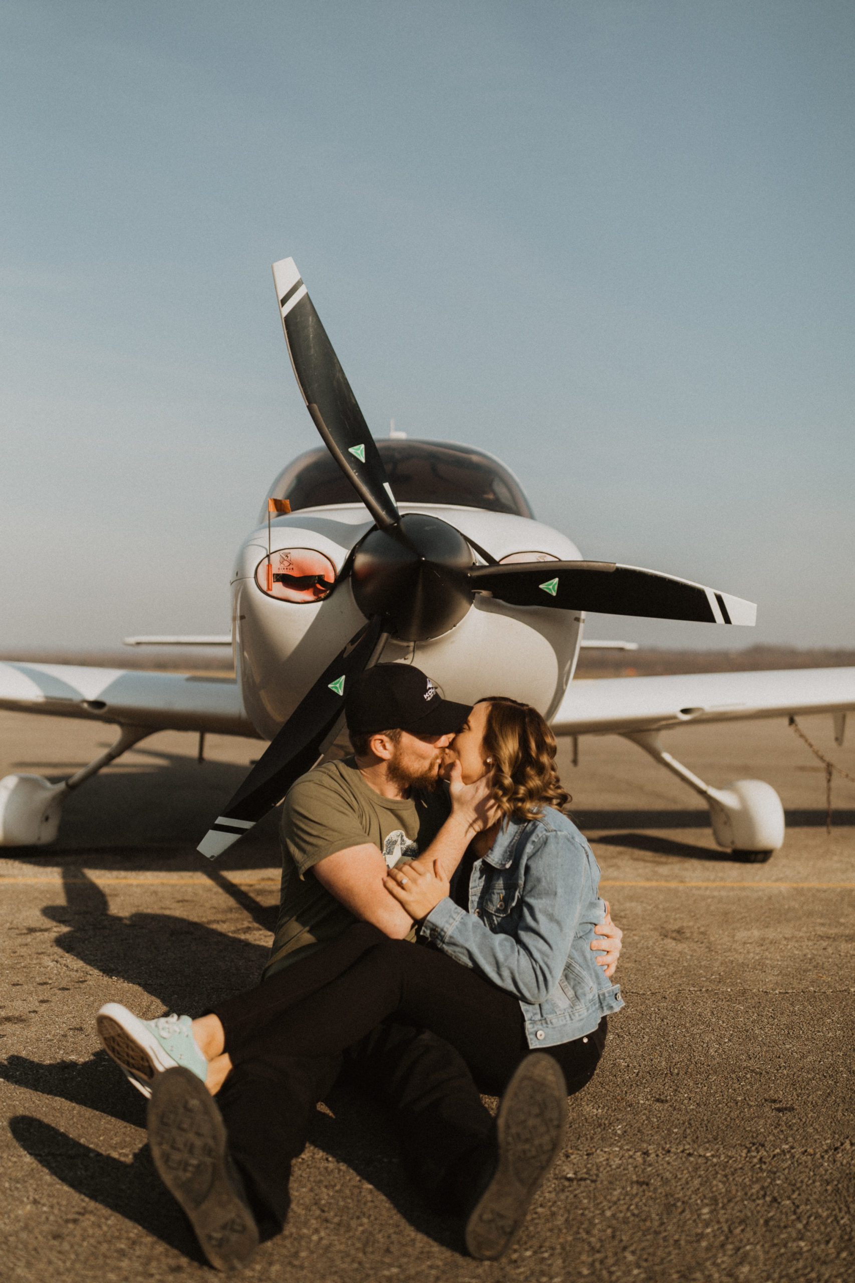 engaged cincinnati couple sitting in plane at  lunken airport