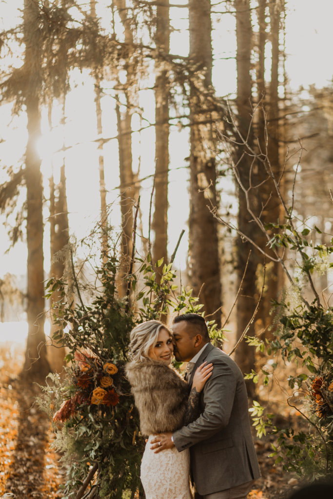 Couple in front of Organic Forest Altar for Pine Tree Elopement in Cincinnati Ohio 