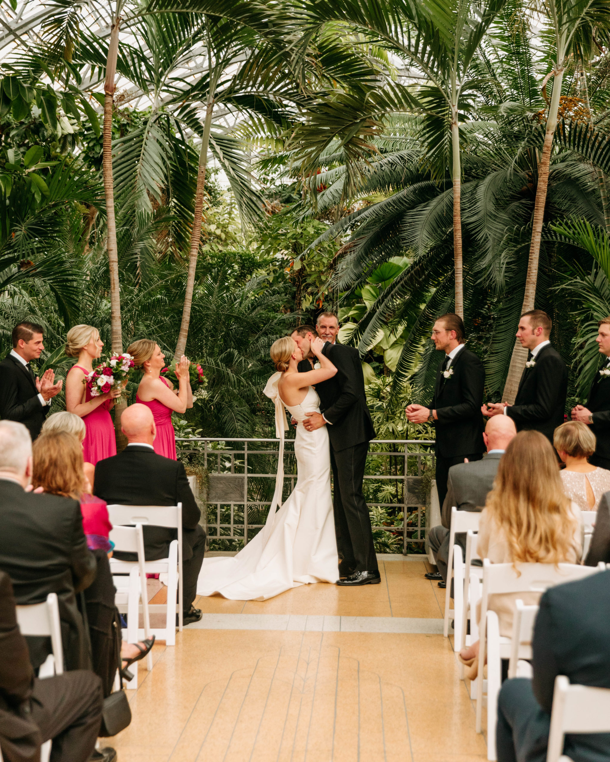 The 'First Kiss' at the wedding ceremony of Christen and Steven at the Krohn Conservatory Wedding Venue. 