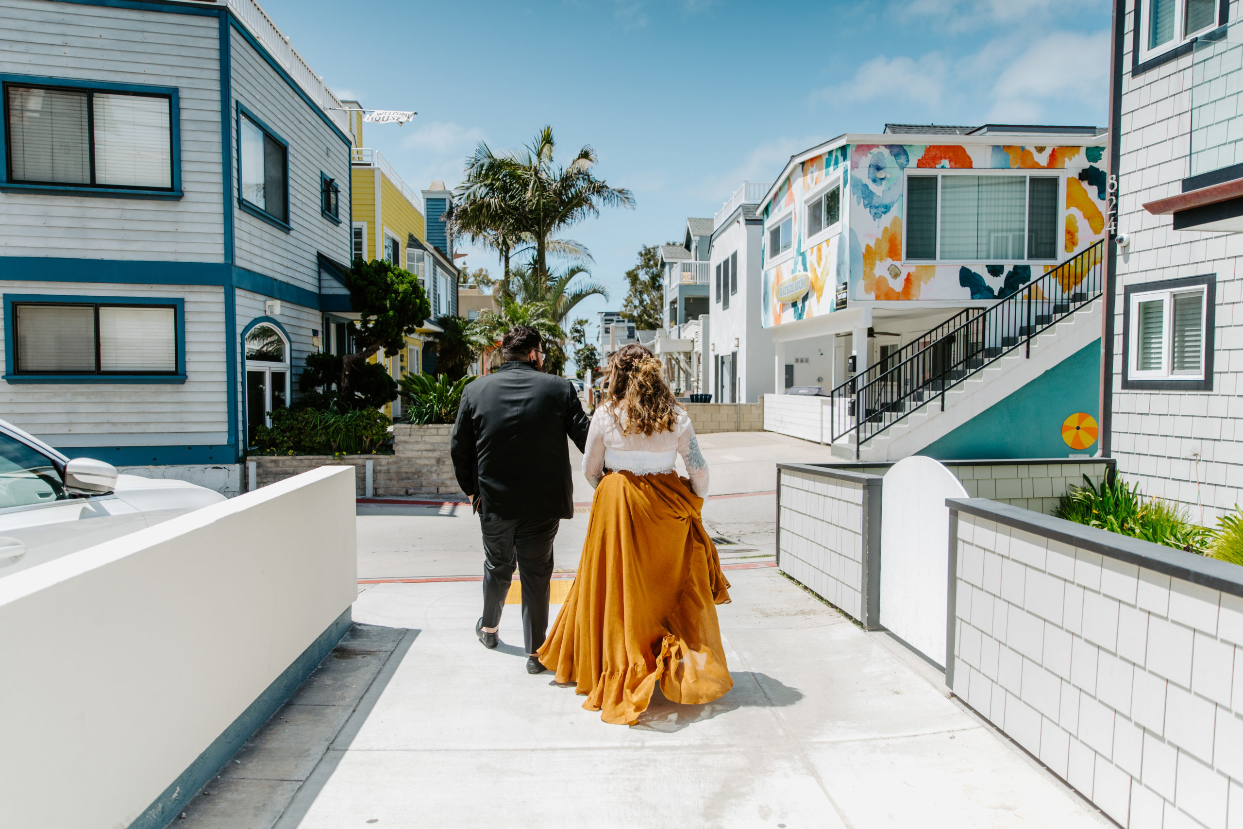 Couple walking the downtown city streets on their San Diego Wedding Day