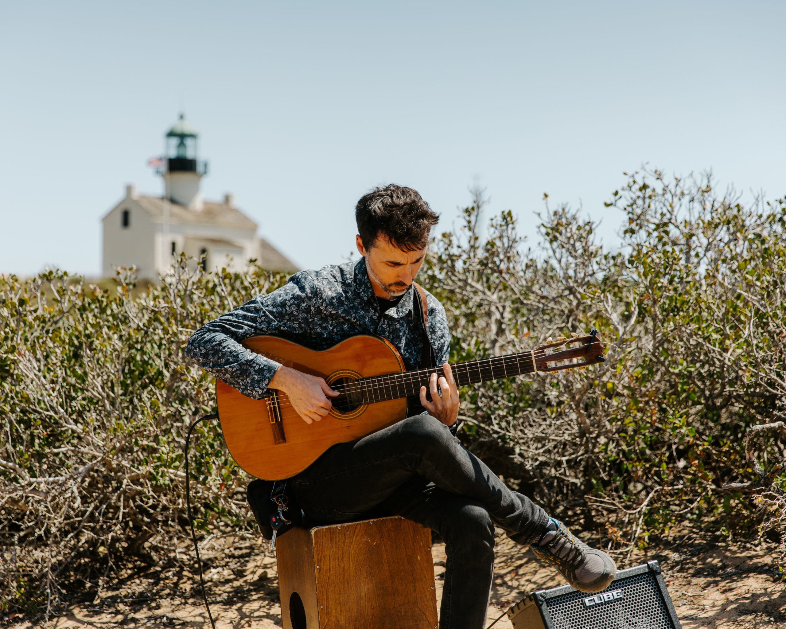 Guitarist playing music live at Cabrillo Monument Wedding Ceremony by the cliffside