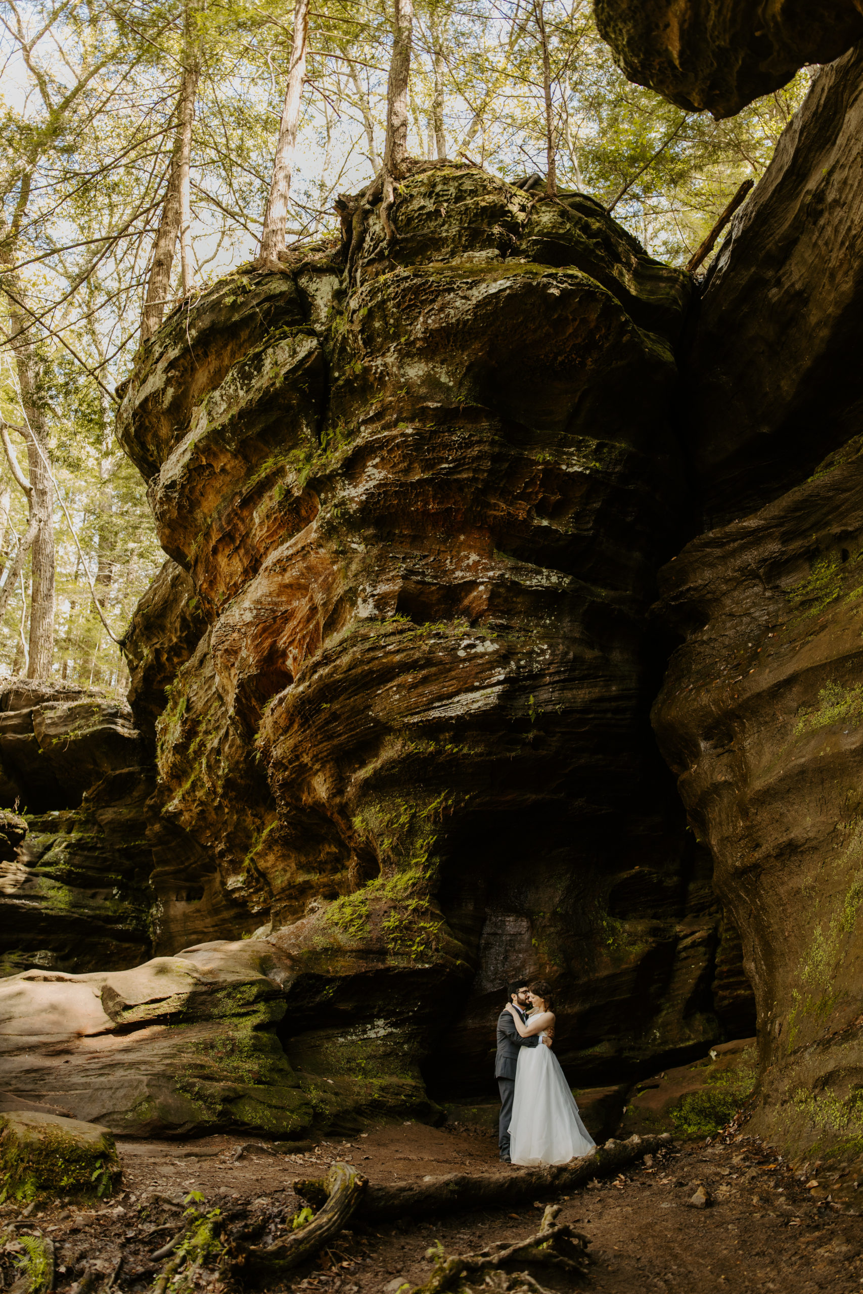 Eloping couple at Hocking Hills standing under rock towers