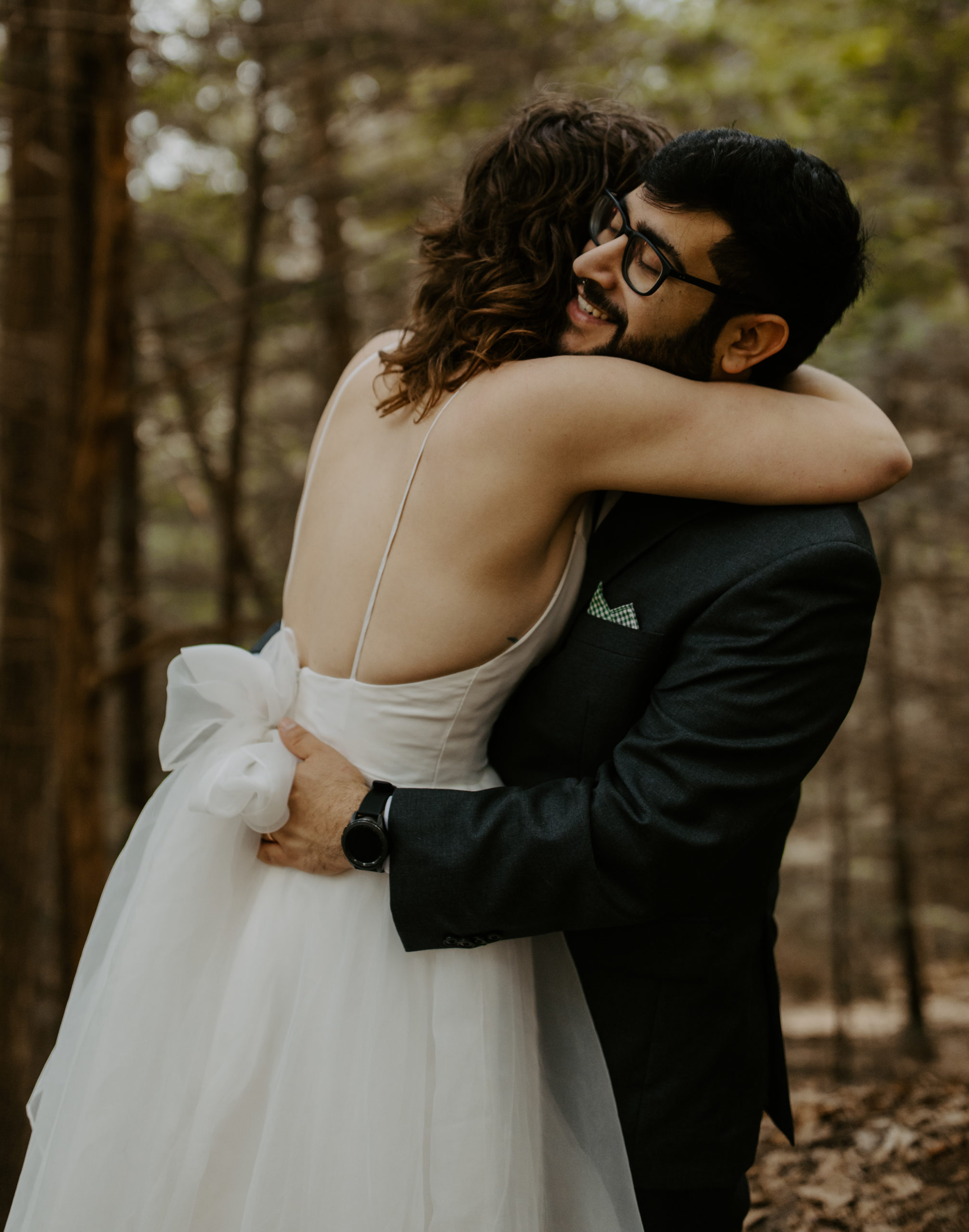 Wedding couple hugging in the forest at Hocking Hills