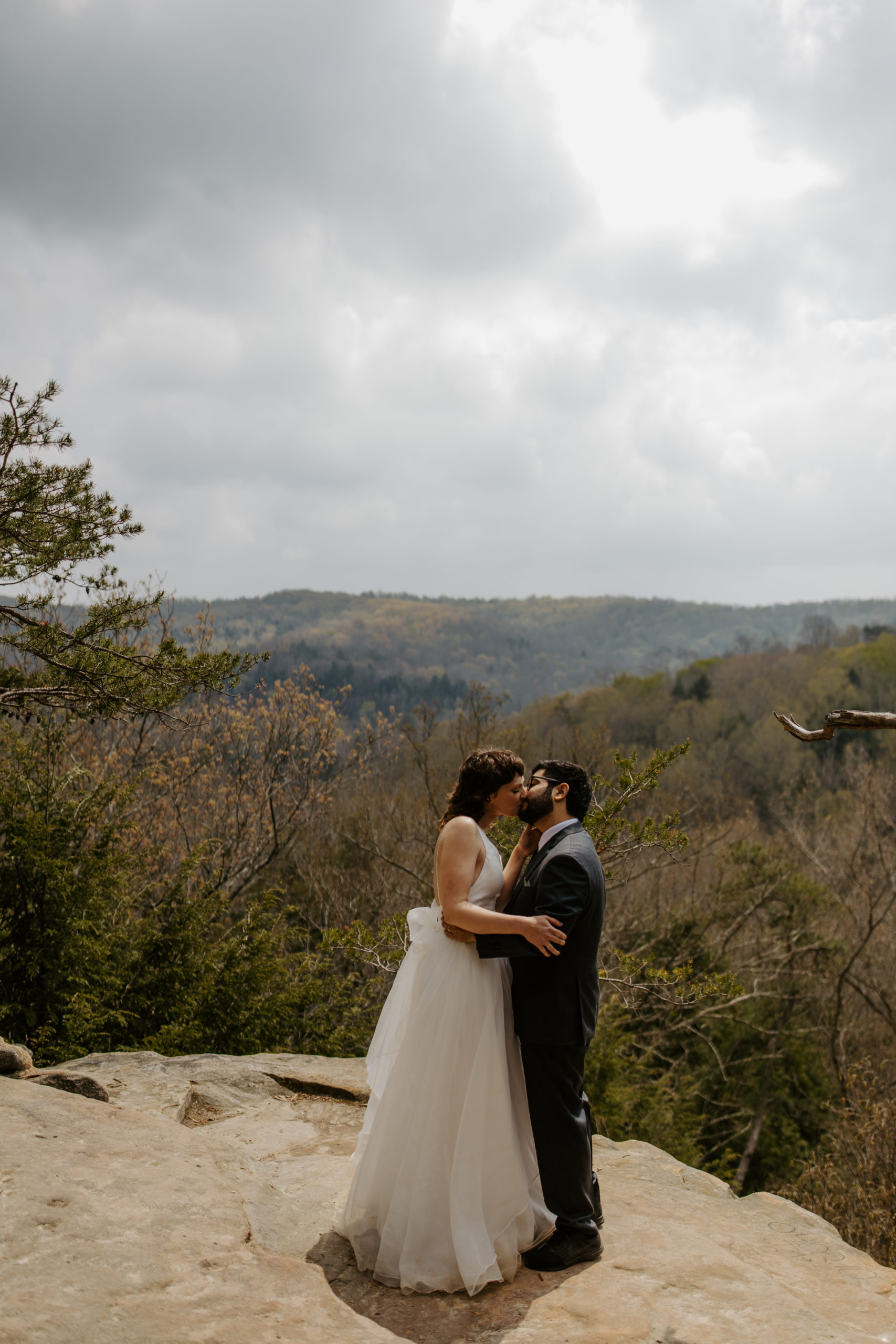 Couple standing on a cliff for their wedding at Hocking Hills