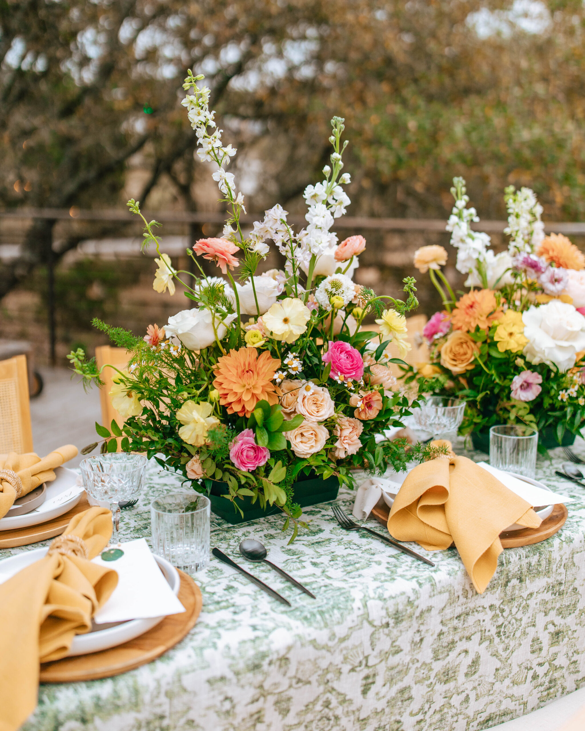 Photograph of a Colorful Spring Wedding Centerpiece. Garden Wedding Themed reception table. 