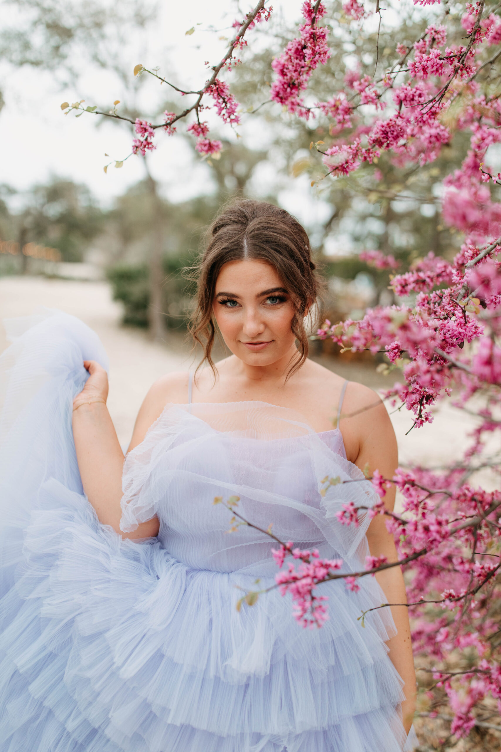 Bridal Portraits in the Spring in front of Blossoms. A spring wedding Inspiration photo.