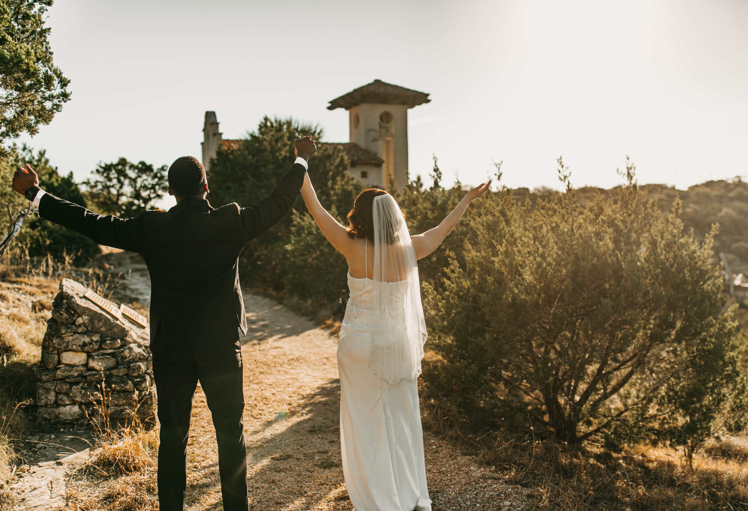 A couple celebrating in a photograph after their elopement at Chapel Dulcinea. 