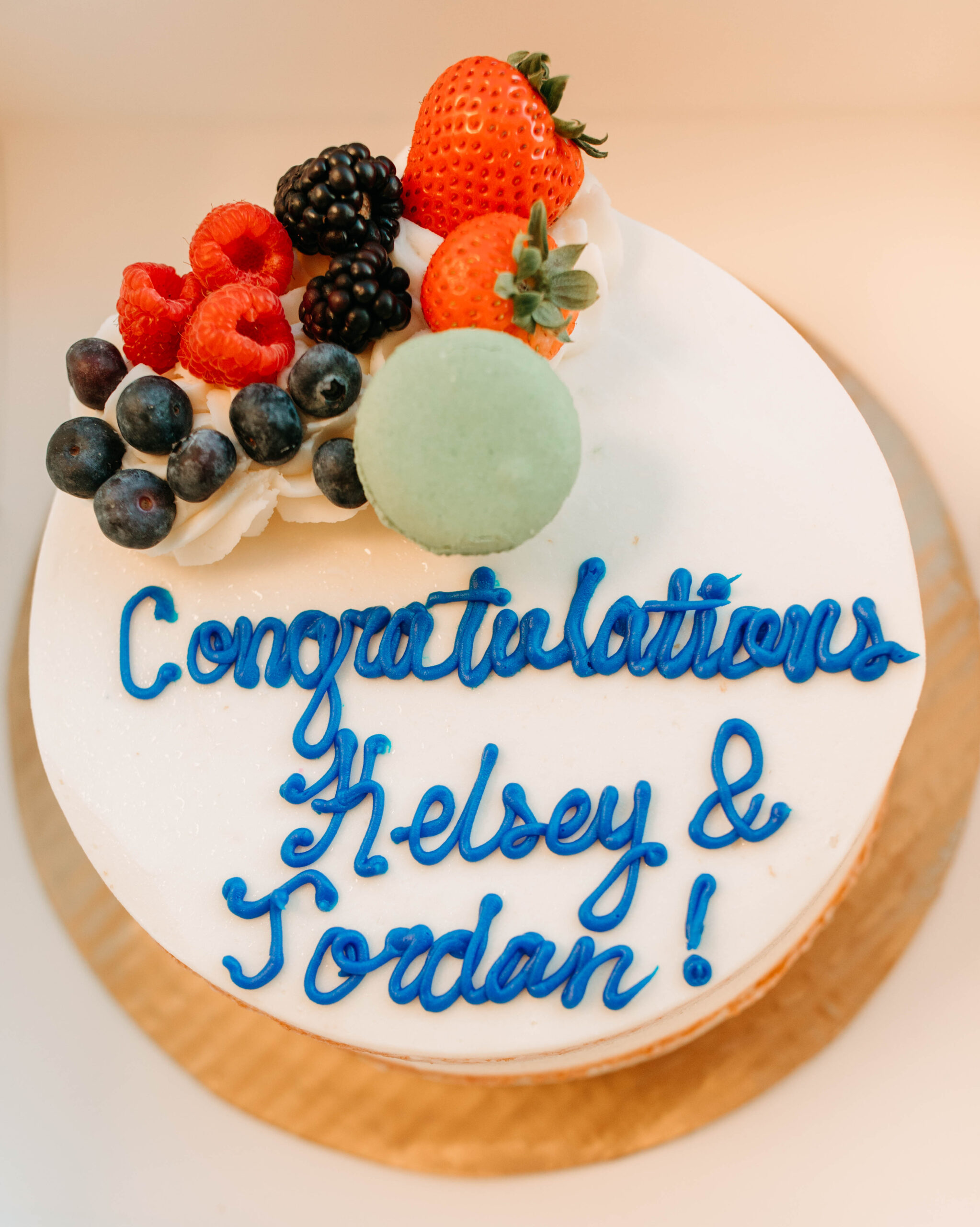 A cake for a couple who just got Engaged in Austin Texas that reads "Congratulations Kelsey and Jordan!"