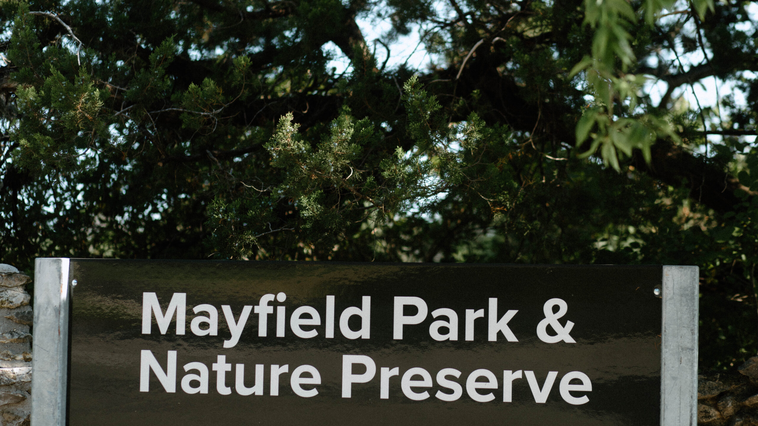 A photograph of the Mayfield Park & Nature Preserve signage outside of the park.