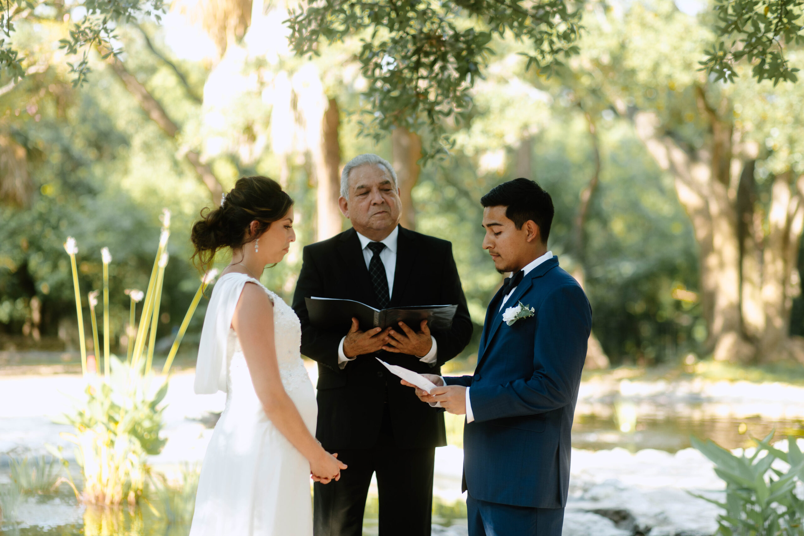 A couple eloping at Mayfield Park in Austin Texas. The two in the photo are Ana and Abel, a couple who hosted their summer wedding at Mayfield Cottage and Gardens.