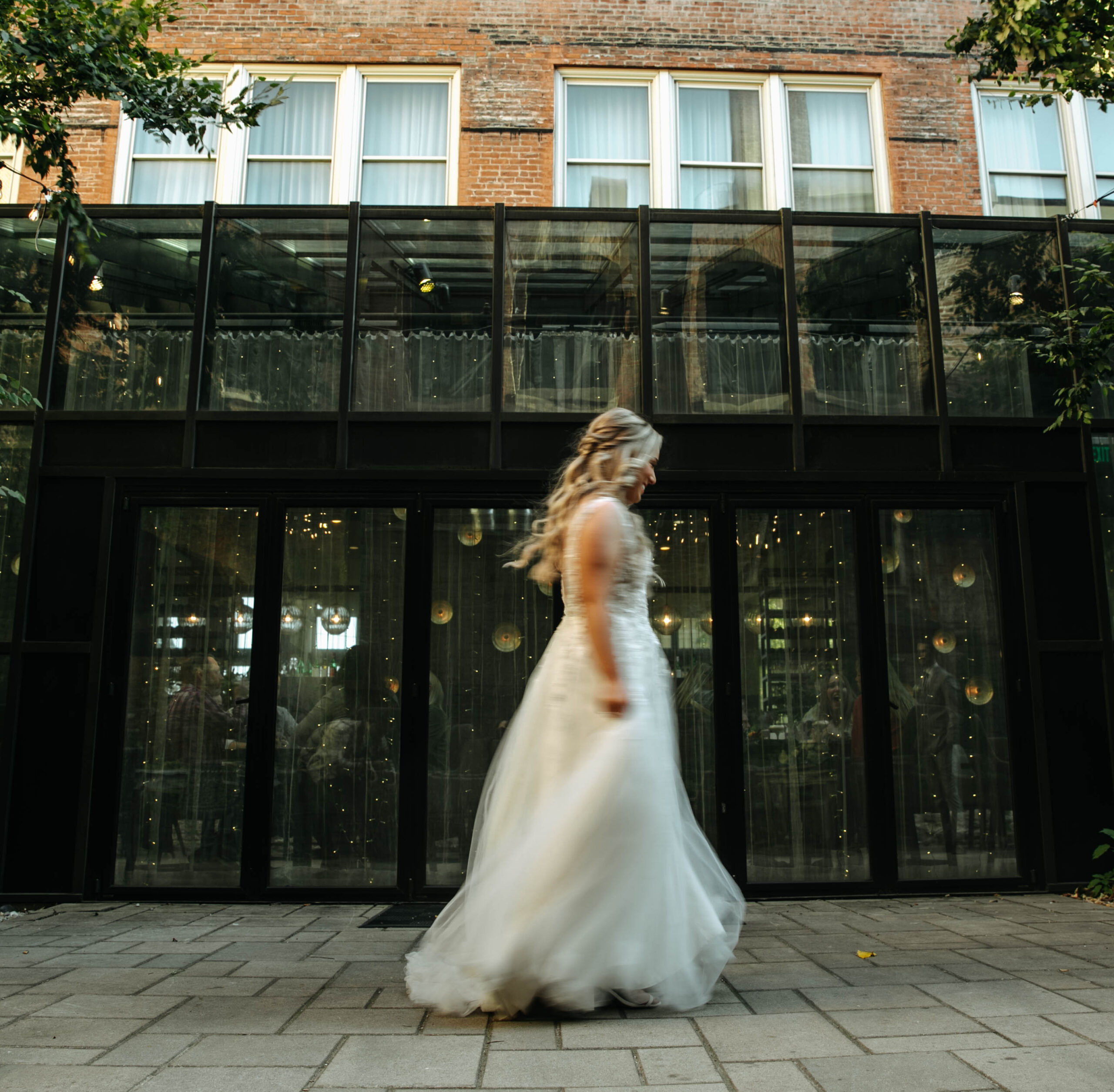 Photograph of a bride spinning in her wedding dress. an editorial wedding photograph at a Hotel Covington Wedding.