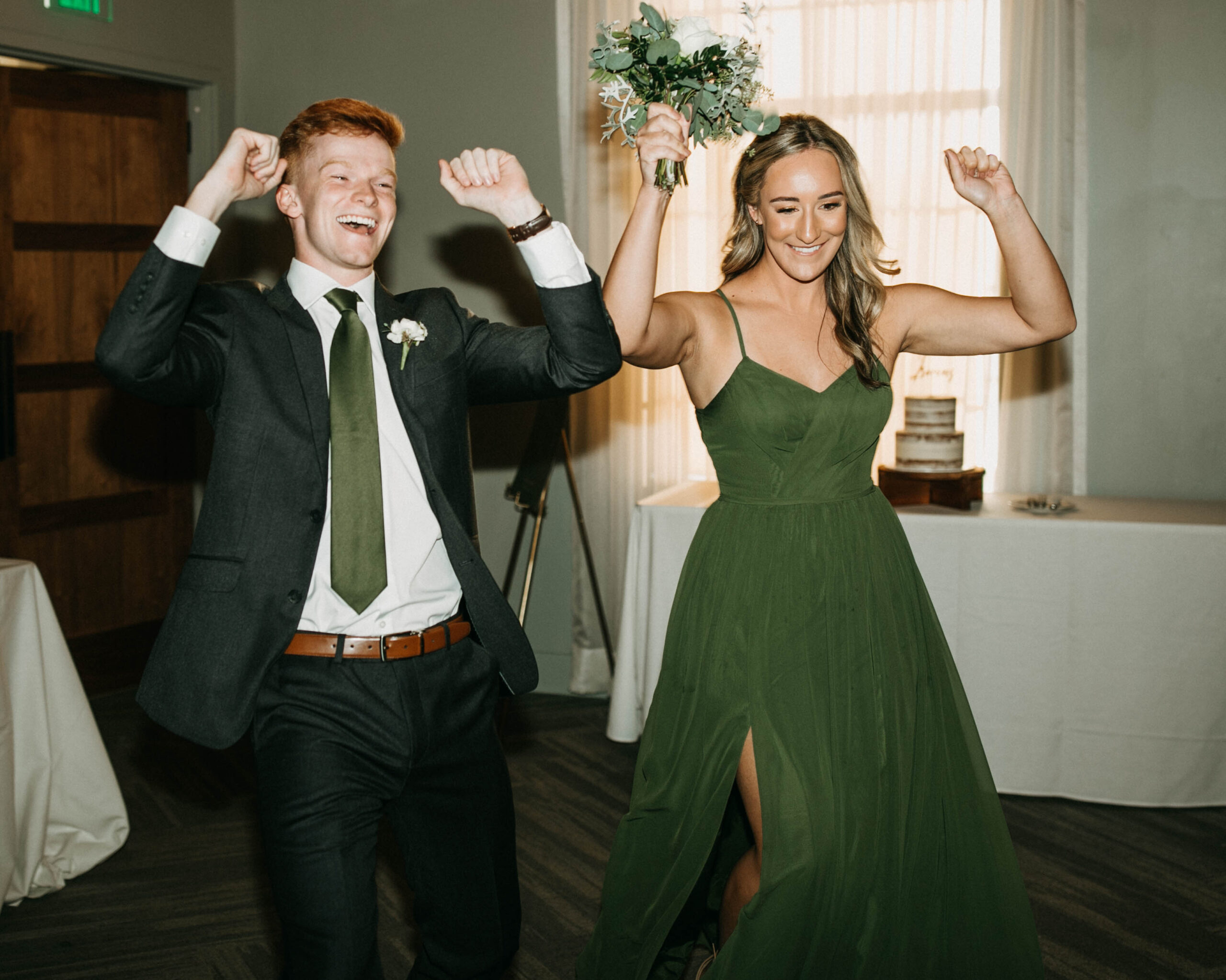A wedding couple being introduced at their wedding reception. A documentary wedding photograph.