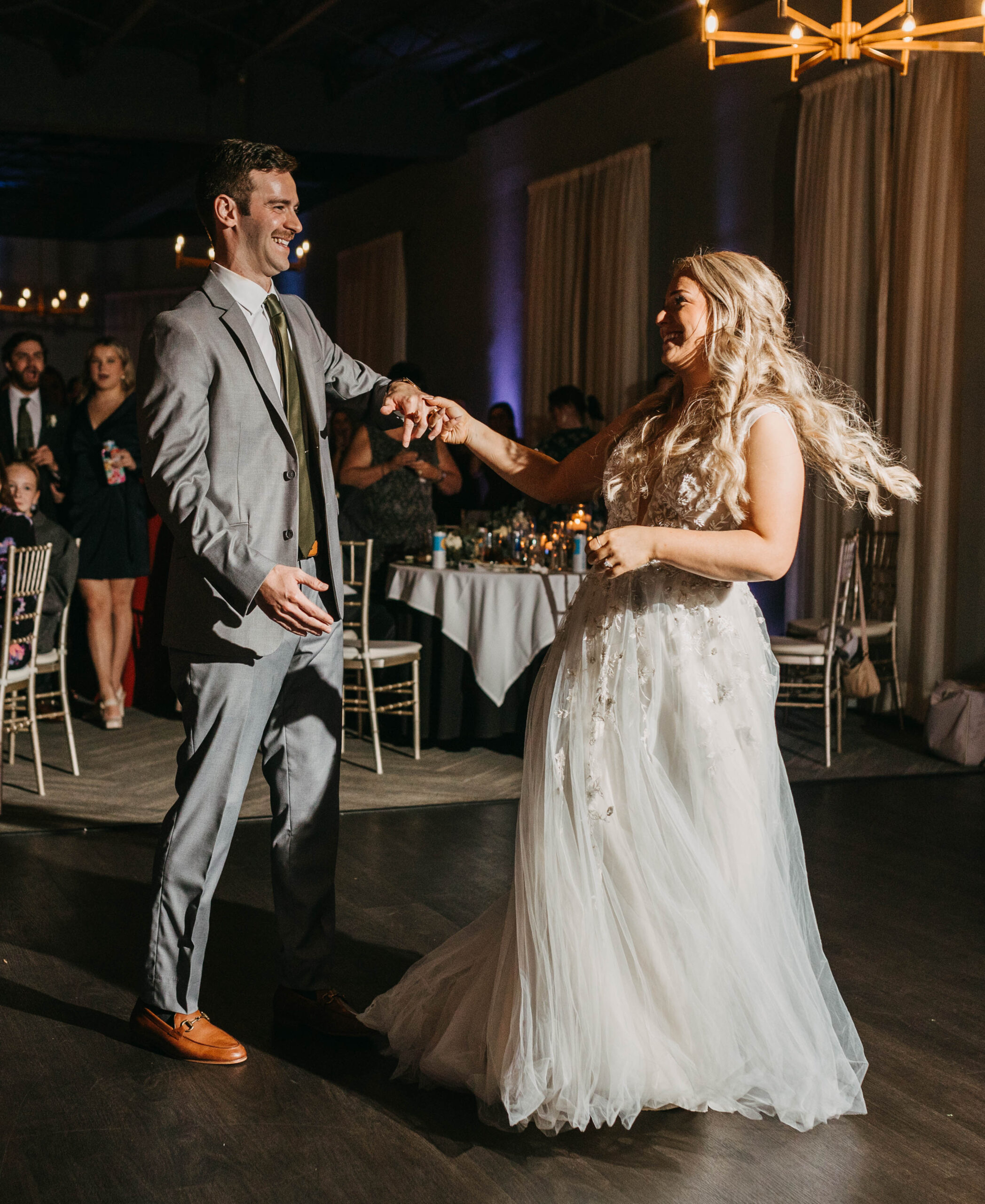 A wedding couple sharing their first dance together at Hotel Covington.
