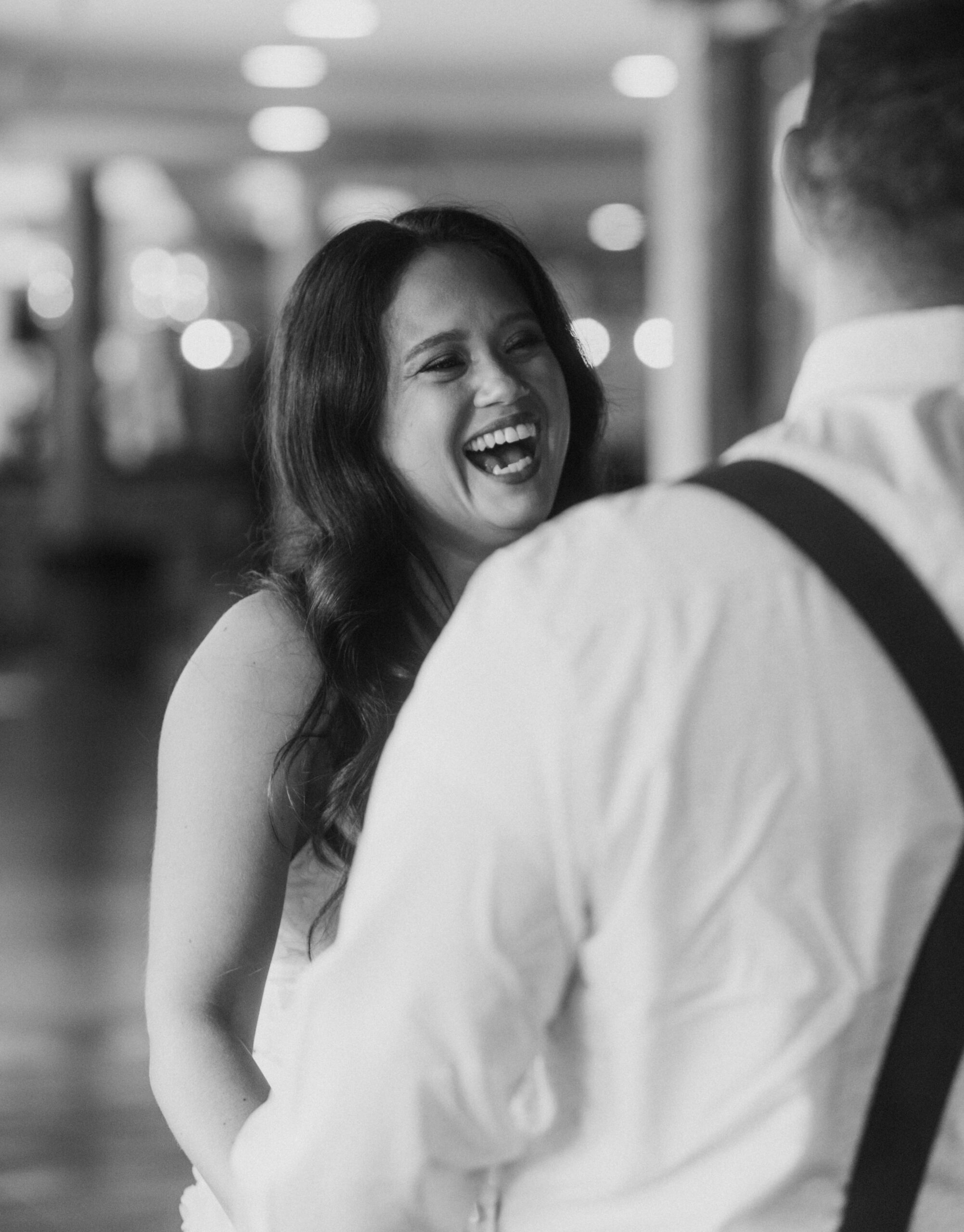 Black and White Candid Photo of Wedding Ceremony at Cidercade - An Arcade Elopement Photography. 
