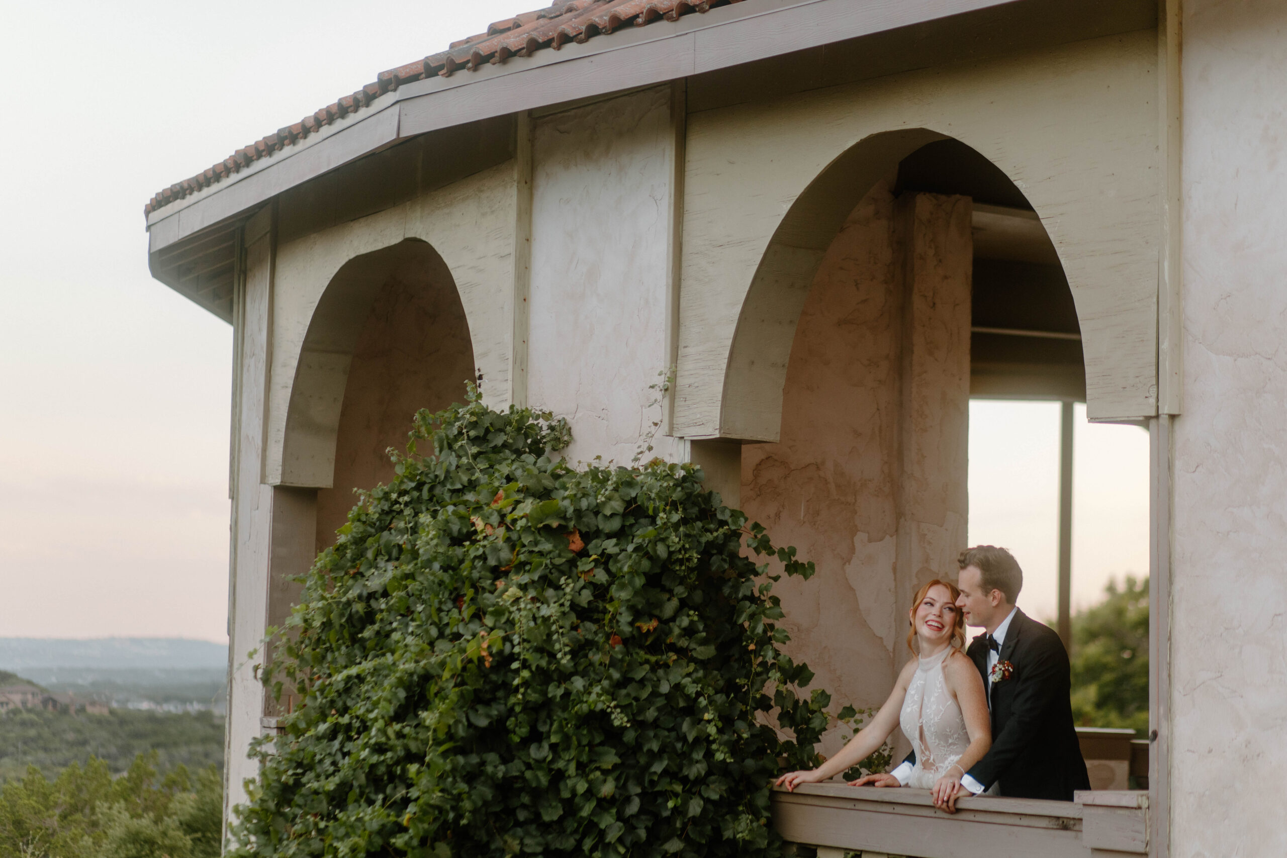 View of the a couple enjoying the overlook from Villa Antonia's Wedding Chapel located in Texas Hill Country. 