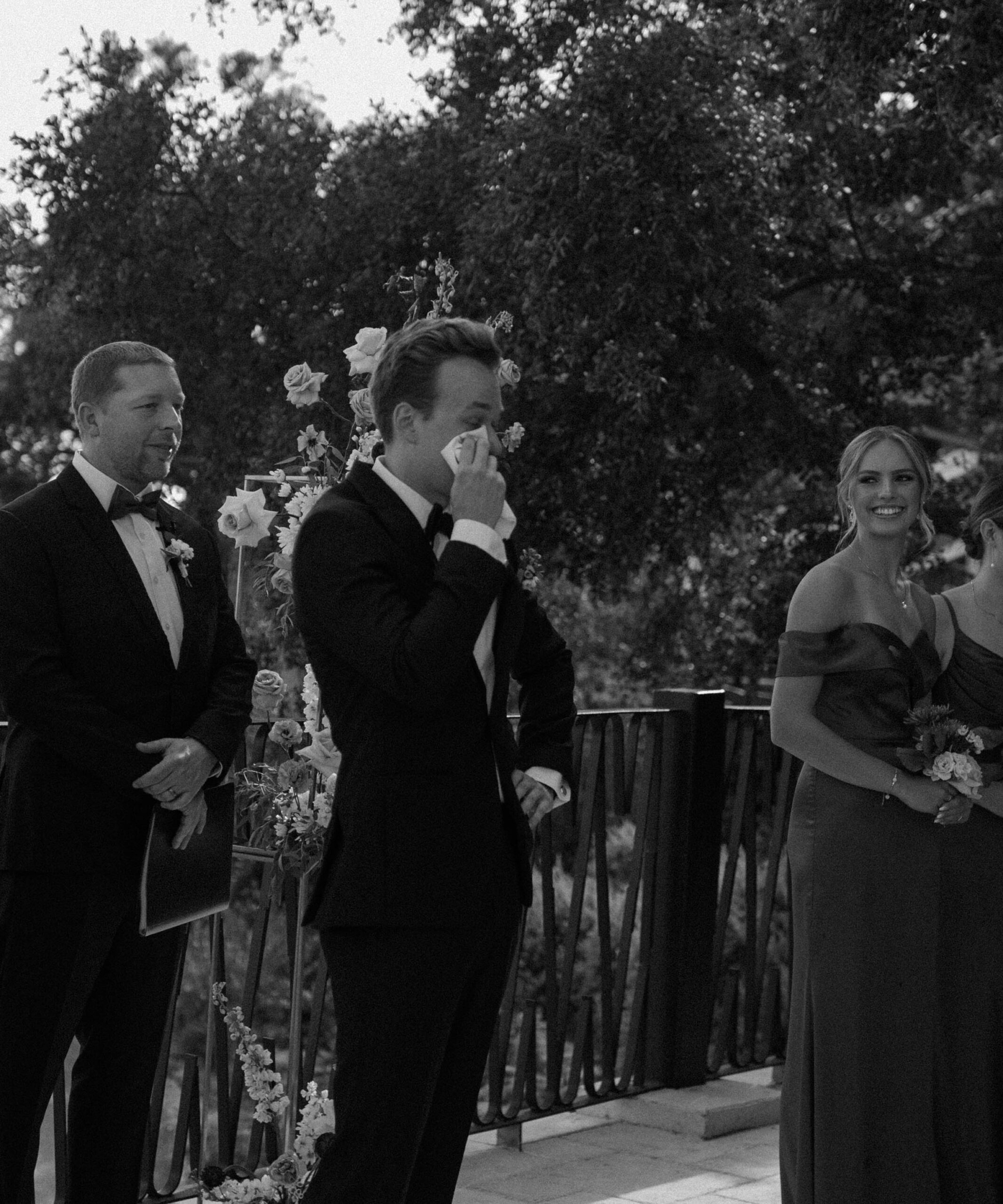 documentary photograph of a Groom's reaction to his bride coming down the wedding aisle at Villa Antonia. 