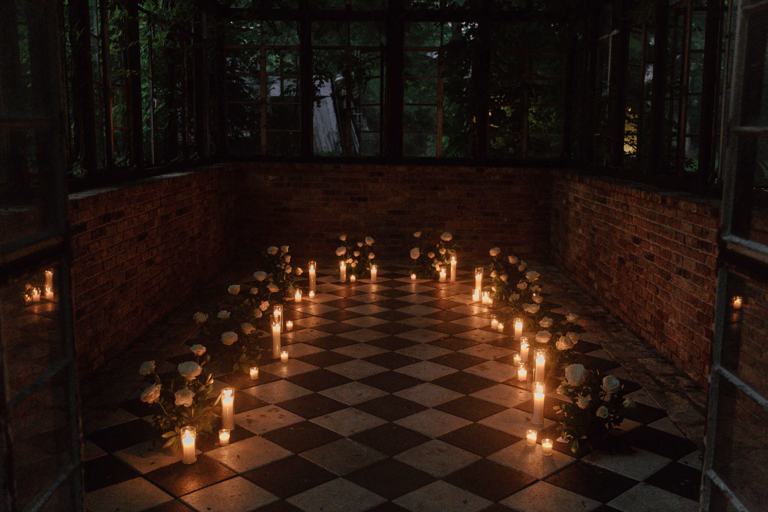 The Sekrit Theater cloaked in candlelight during the evening for a proposal.